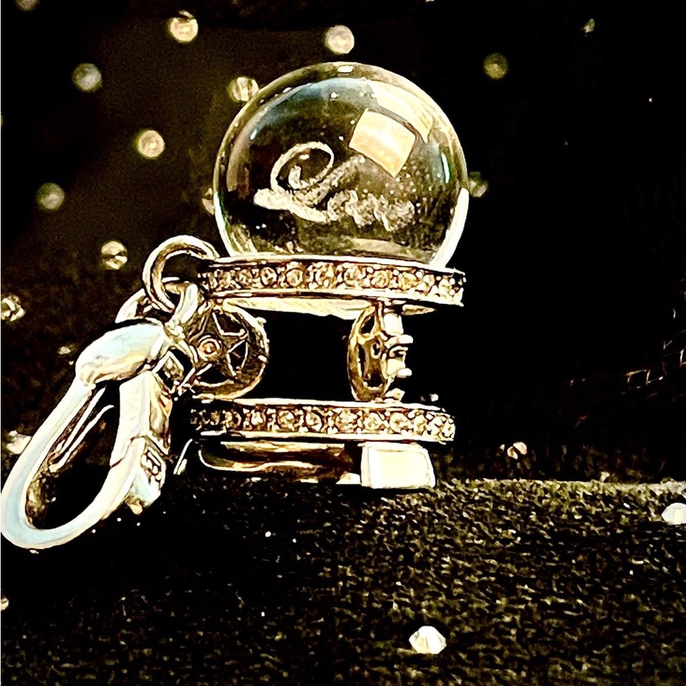 Rare original juicy couture Crystal ball charm with the word love glowing inside